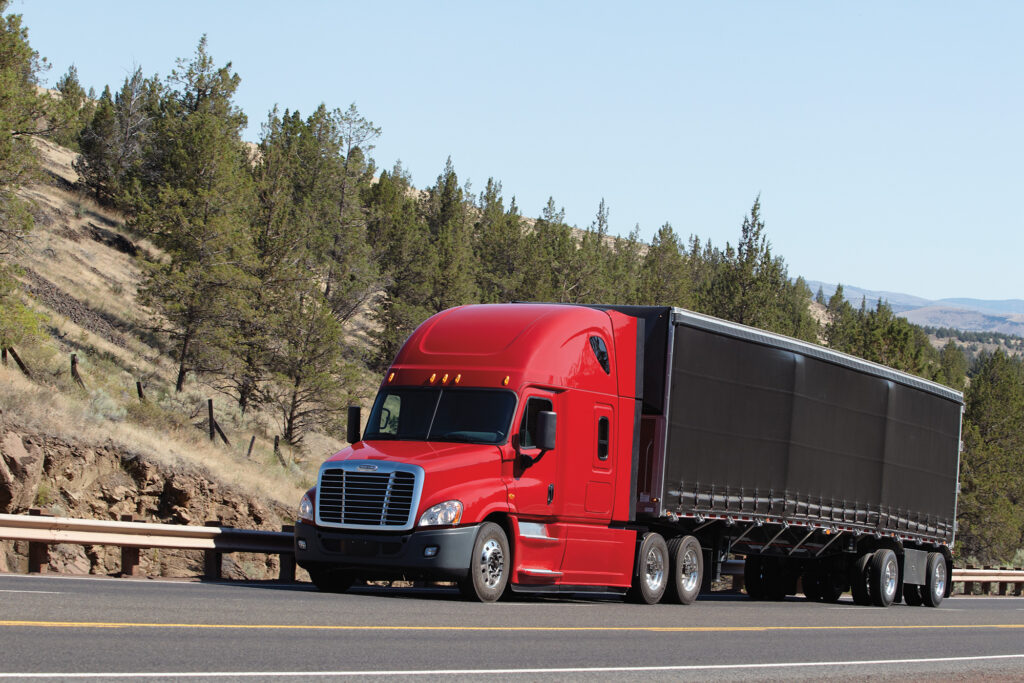 A Daimler truck traveling on a highway.