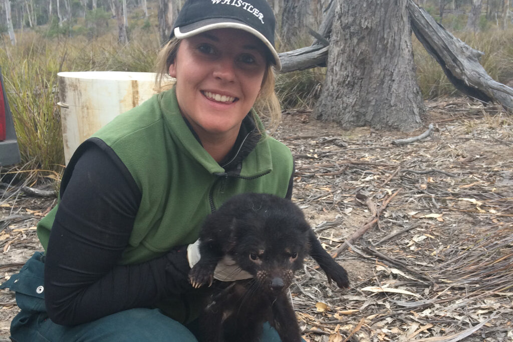 Woman holds a Tasmanian devil