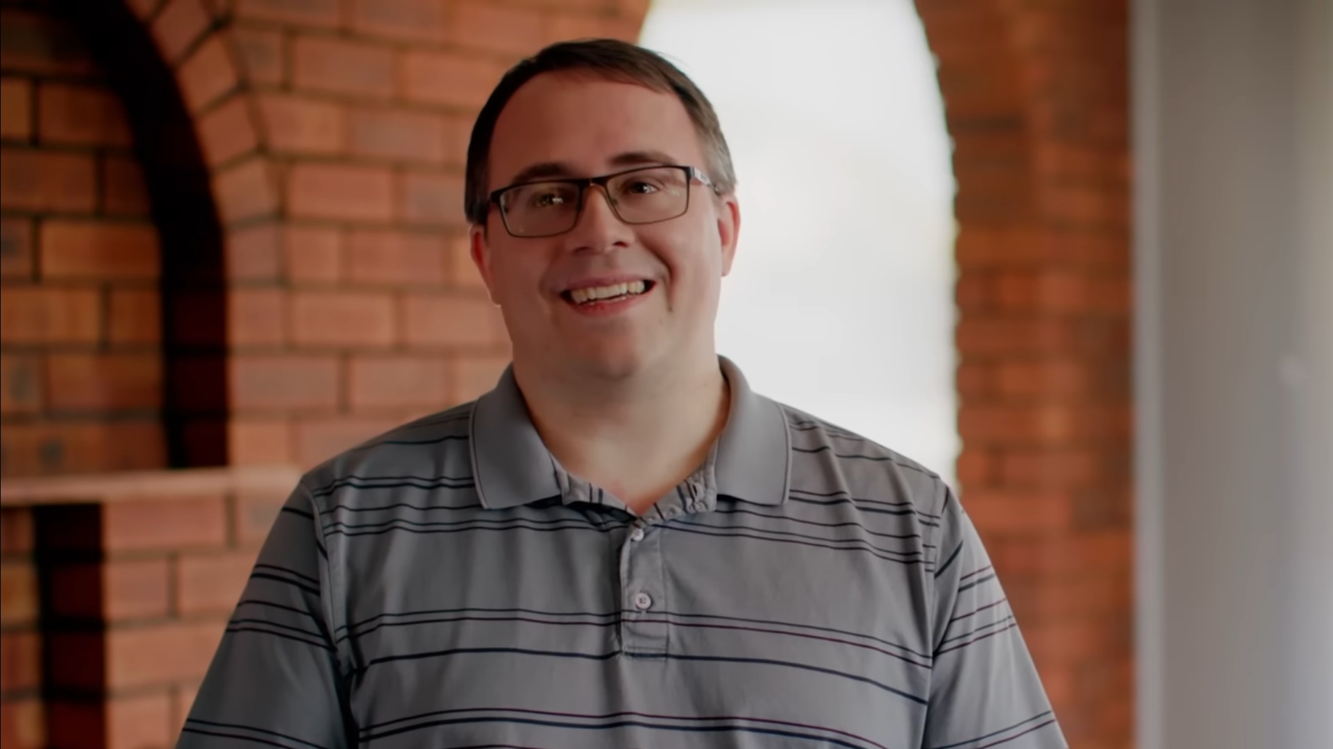 Man wearing glasses smiling