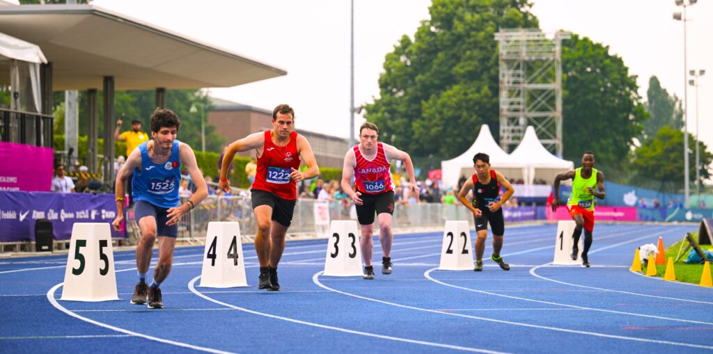 Runners race on a track at the 2023 Special Olympics World Games in Berlin.