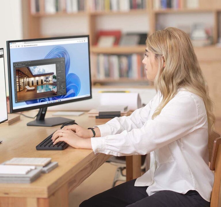 Woman working at a desktop computer