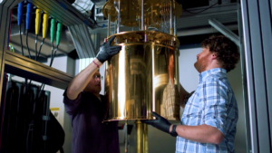 Two researchers working on a quantum machine