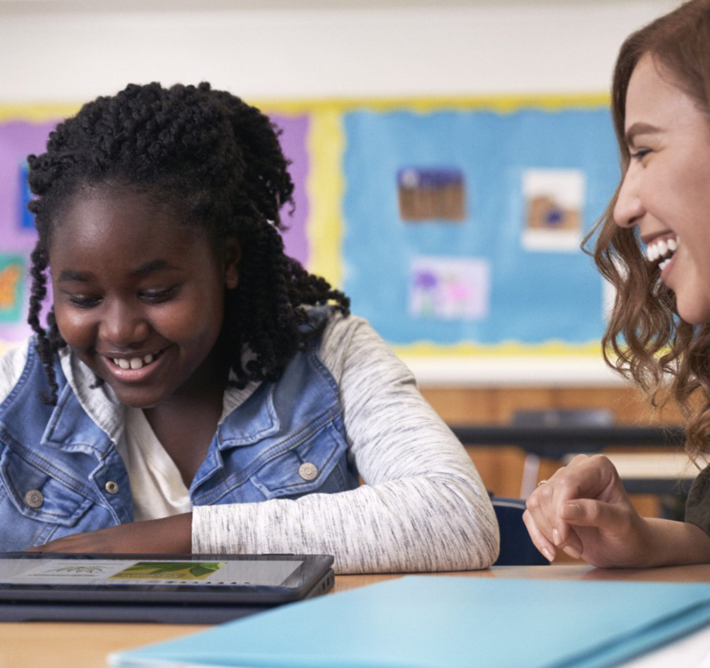 Student and teacher interacting in a classroom