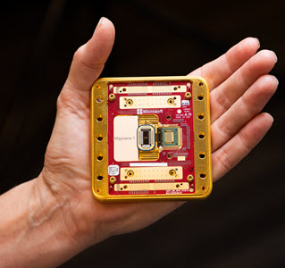 Photo showing a close up of the Majorana 1 quantum chip being held in a hand.