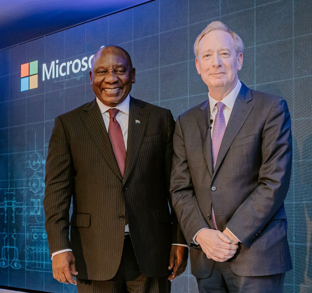 Two men standing as they pose for a photo